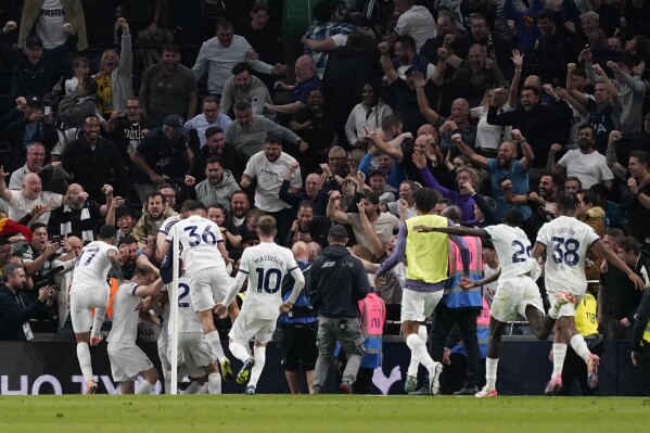 Players of Tottenham celebrate after Liverpool's Joel Matip scored an own goal during the English Premier League soccer match between Tottenham Hotspur and Liverpool at the Tottenham Hotspur Stadium, in London, England, Saturday, Sept. 30, 2023. (AP Photo/Alberto Pezzali)