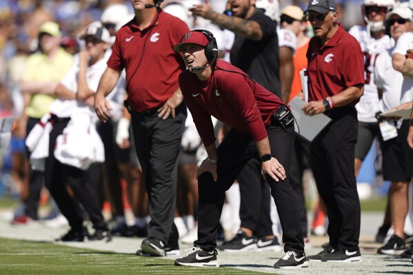 Washington State head coach Jake Dickert watches a field goal attempt during the first half of an NCAA college football game against UCLA, Saturday, Oct. 7, 2023, in Pasadena, Calif. (AP Photo/Ryan Sun)