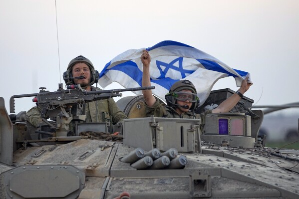 Israeli tanks head toward the Gaza Strip border in southern Israel on Thursday, Oct.12, 2023. (AP Photo/Ohad Zwigenberg)