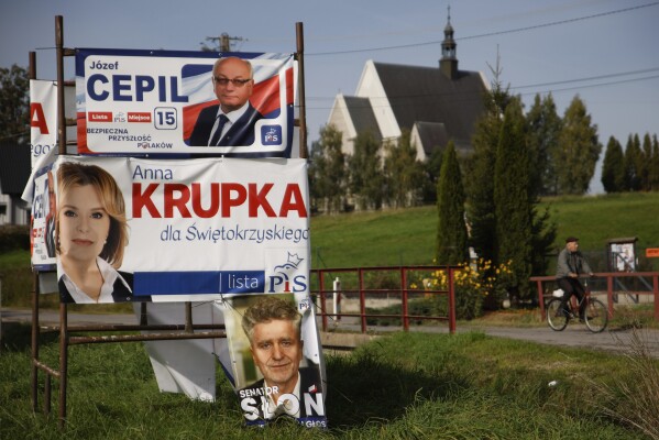 Political campaign banners hang in Krajno, Poland, Wednesday, Oct. 11, 2023. Poland is holding a parliamentary election on Oct. 15 which many Poles view as the most important once since the nation threw off communist rule in 1989. (AP Photo/Michal Dyjuk)