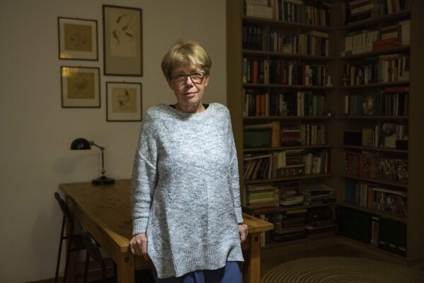 Social activist Danuta Kuron, who was an anti-communist dissident with Poland's Solidarity movement, poses for a picture in her home in Warsaw, Poland, Monday, Oct. 9, 2023. Like many other former Solidarity activists, Kuron is critical of what has happened in Poland, where democratic checks and balances have been weakened by a populist government over the past eight years. Concerns about democracy are driving the choice of many Poles as they prepare to vote in a national election Sunday viewed as the most important one since 1989. (AP Photo/Michal Dyjuk)