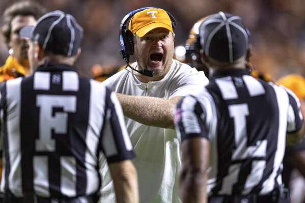 Tennessee coach Josh Heupel yells at line judge Jeremiah Harris during the second half of the team's NCAA college football game against South Carolina on Saturday, Sept. 30, 2023, in Knoxville, Tenn. (AP Photo/Wade Payne)