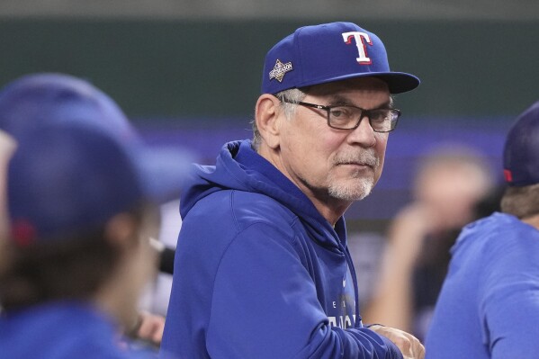 Texas Rangers manager Bruce Bochy watches batting practice before Game 3 of the baseball team's AL Division Series against the Baltimore Orioles in Arlington, Texas, Tuesday, Oct. 10, 2023. (AP Photo/LM Otero)