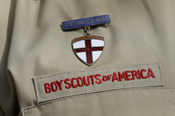 FILE - A close up of a Boy Scout uniform is photographed on Feb. 4, 2013, in Irving, Texas. Ohio victims of child sexual abuse while in the Boy Scouts of America will see more compensation for the crimes committed against them after Republican Gov. Mike DeWine signed a new law guaranteeing it Thursday, Oct. 12, 2023. (AP Photo/Tony Gutierrez, File)