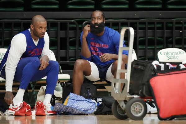 Philadelphia 76ers forward P.J. Tucker, left, talks with guard James Harden during the NBA basketball team's practice on Thursday, Oct. 5, 2023, in Fort Collins, Colo. (AP Photo/David Zalubowski)