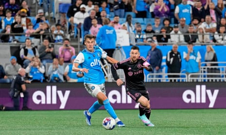 Charlotte FC midfielder Andrew Privett battles for the ball with Inter Miami CF forward Lionel Messi during the second half at Bank of America Stadium.