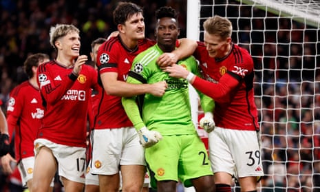 Harry Maguire and Scott McTominay celebrate with André Onana after his late penalty save against Copenhagen in the Champions League.
