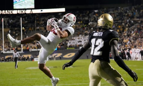 Stanford safety Alaka'i Gilman, left, intercepts a pass intended for Colorado wide receiver Travis Hunter in the end zone in overtime of Friday night’s game in Boulder, Colorado.