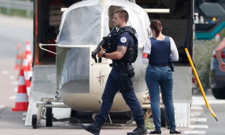 Armed police next to the helicopter abandoned by Rédoine Faïd in 2018.