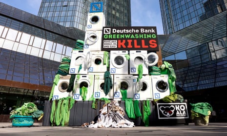 Activists place washing machines in front of the Deutsche Bank headquarters to protest against greenwashing during Deutsche Bank AG Annual Shareholders Meeting in Frankfurt, Germany, in May 2022.