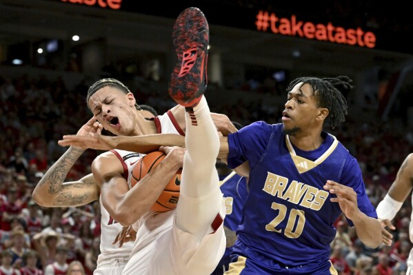 Arkansas forward Trevon Brazile, left, gets a rebound in front of Alcorn State forward Trevon Stoutermire (20) during the first half of an NCAA college basketball game Monday, Nov. 6, 2023, in Fayetteville, Ark. (AP Photo/Michael Woods)