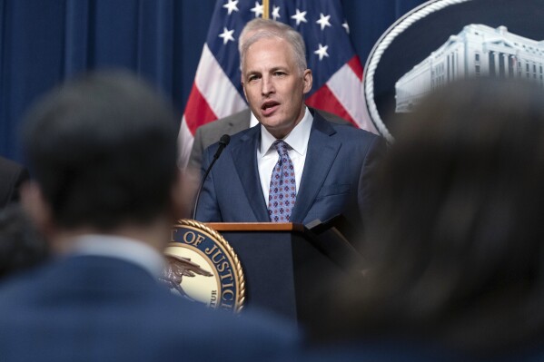 FILE - Assistant Attorney General Matthew Olsen of the Justice Department's National Security Division speaks during a news conference at the Department of Justice in Washington, May 16, 2023. With just seven weeks until the end of the year, the Biden administration is running out of time to win the reauthorization of a spy program it says is vital to preventing terrorism, catching spies and disrupting cyberattacks. The tool is called Section 702 of the Foreign Intelligence Surveillance Act. (AP Photo/Jose Luis Magana, File)