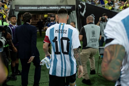 Lionel Messi leaves field after fighting in the stands.